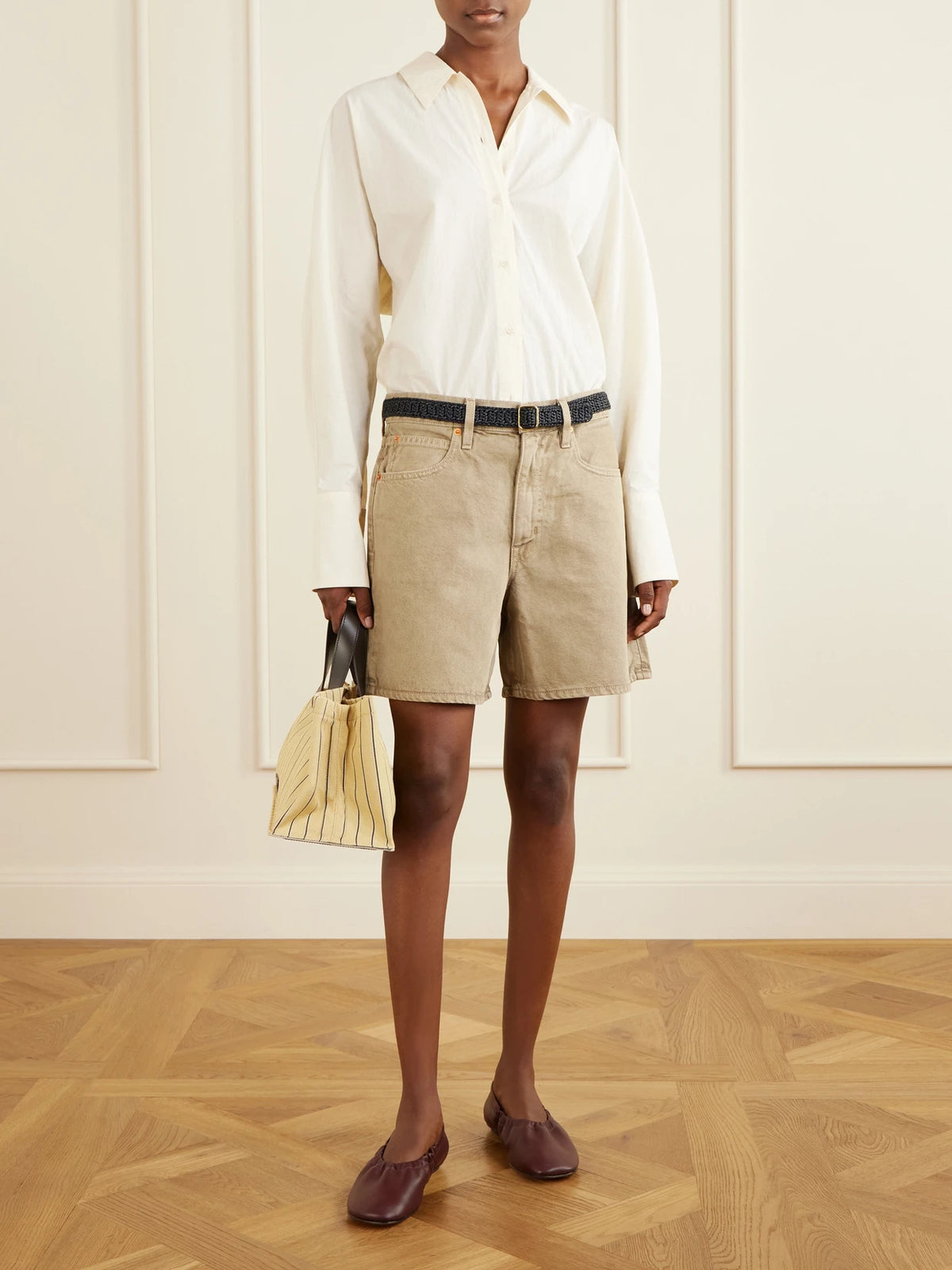 Image of a model wearing Shorts. Product name - Walker Cotton Short in Army green colour by brand - SLVRLAKE
