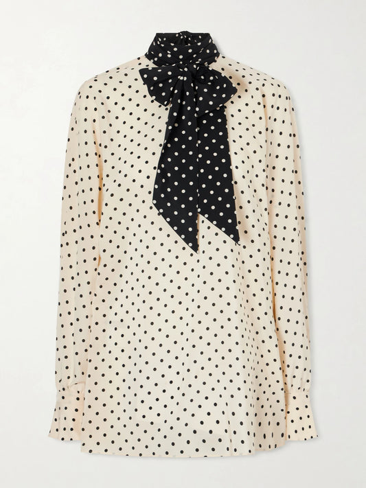 Image of a model wearing Tops. Product name - Scarf-detailed Polka-dot Silk Crepe De Chine Blouse in White colour by brand - Valentino Garavani