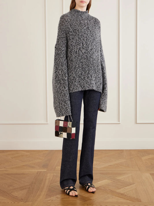 Image of a model wearing Outerwear. Product name - Seth Oversized Cashmere And Silk-blend Mélange Turtleneck Sweater in Light gray, Red colour by brand - KHAITE