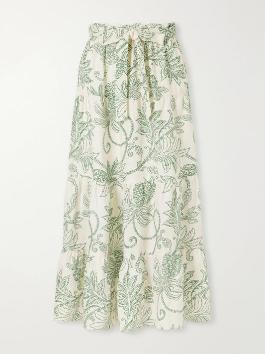 Image of a model wearing Skirts. Product name - Sanaa Tiered Printed Linen Midi Skirt in Green colour by brand - lemlem