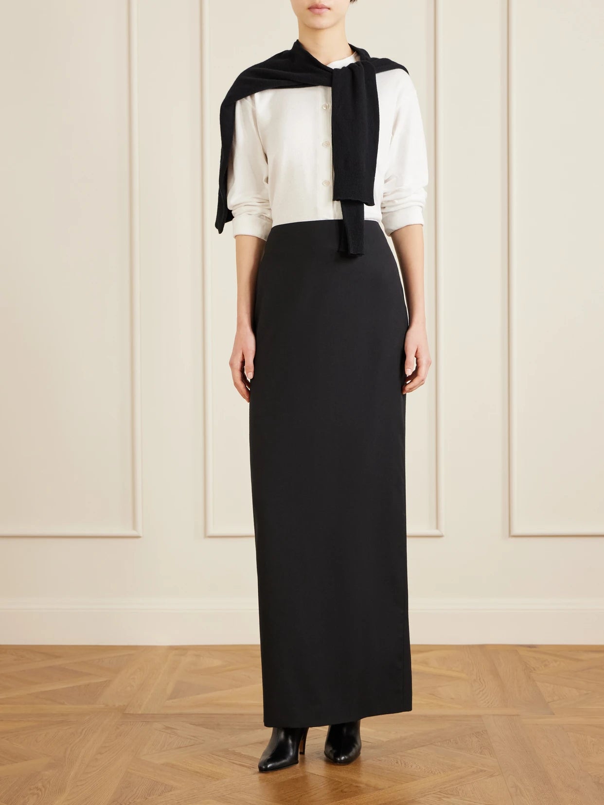 Image of a model wearing Skirts. Product name - Bartelle Wool Maxi Skirt in Black colour by brand - The Row