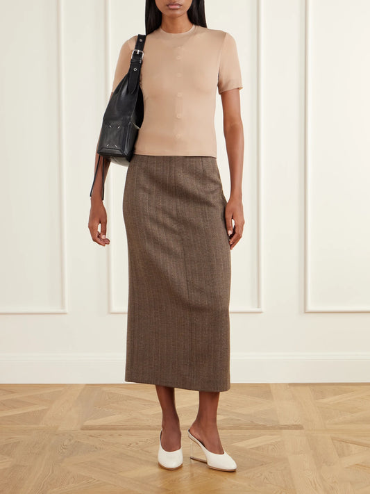 Image of a model wearing Skirts. Product name - Wool-herringbone Midi Skirt in Beige colour by brand - Maison Margiela
