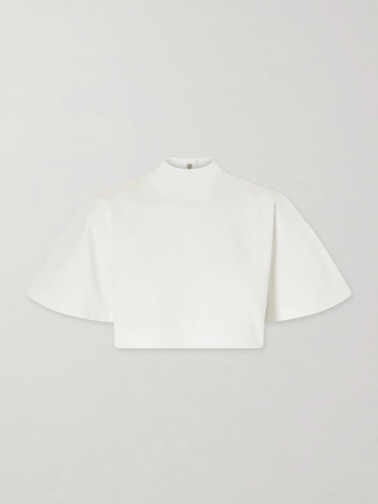 Image of a model wearing Tops. Product name - Cropped Cotton-jersey Turtleneck T-shirt in White colour by brand - Alaïa