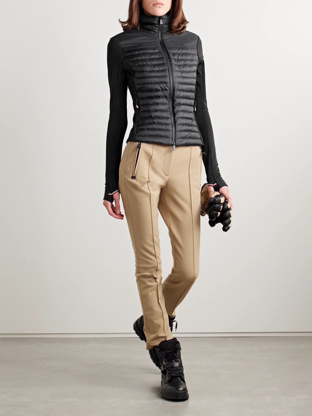 Image of a model wearing Tops. Product name - Power Grid Paneled Polartec Jersey And Quilted Shell Down Base Layer in Black colour by brand - Moncler Grenoble