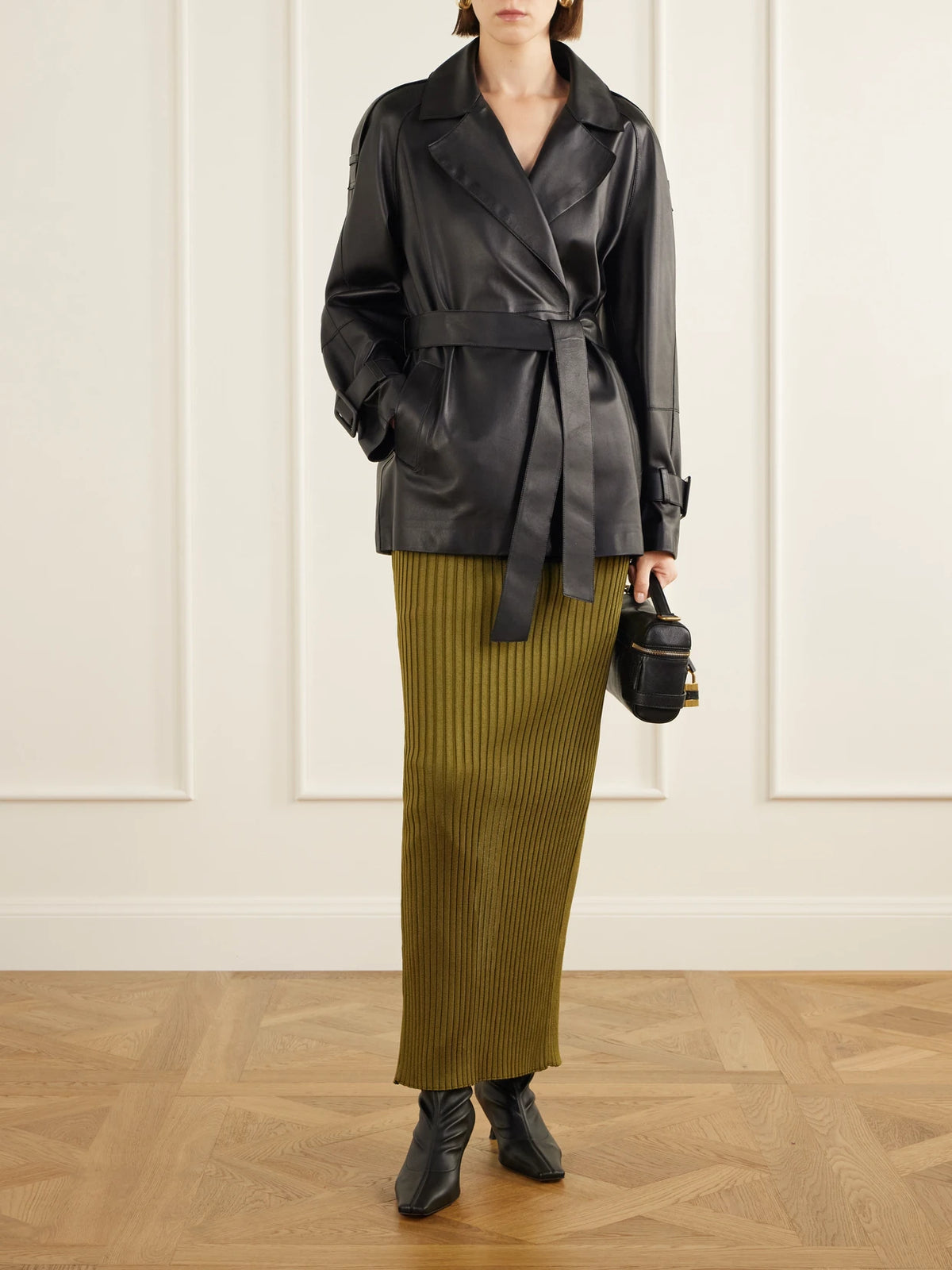 Image of a model wearing Skirts. Product name - Ribbed Stretch Maxi Skirt in Army green colour by brand - Balmain
