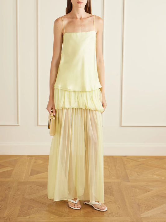 Image of a model wearing Skirts. Product name - Silk-chiffon Maxi Skirt in Pastel yellow colour by brand - LIBEROWE