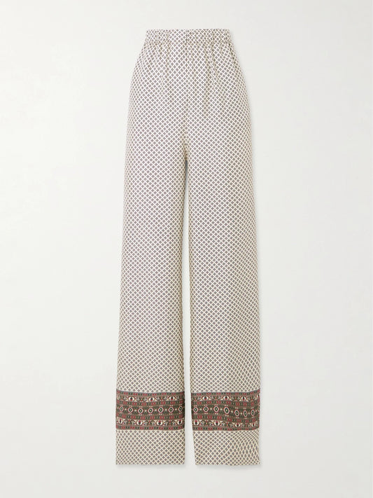 Image of a model wearing Pants. Product name - Valerio Printed Silk-twill Wide-leg Pants in Beige colour by brand - Loro Piana