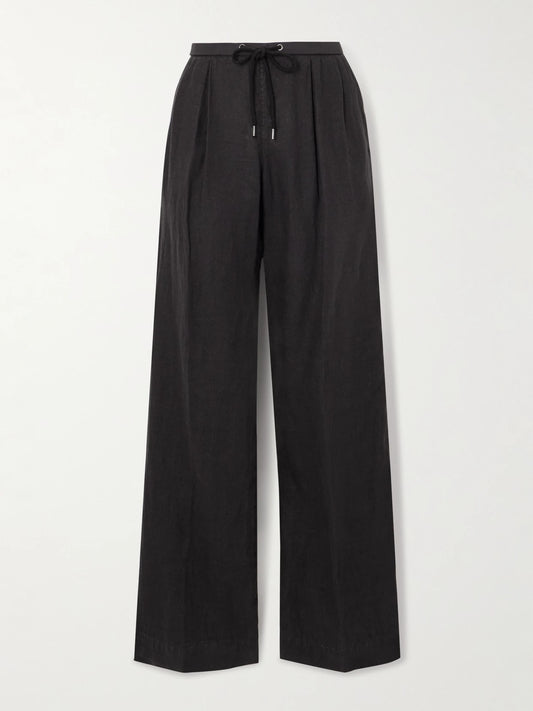 Image of a model wearing Pants. Product name - Pleated Linen Wide-leg Pants in Black colour by brand - James Perse