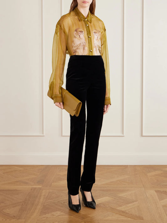 Image of a model wearing Pants. Product name - Ryden Darted Wool-blend Velvet Straight-leg Pants in Black colour by brand - KHAITE