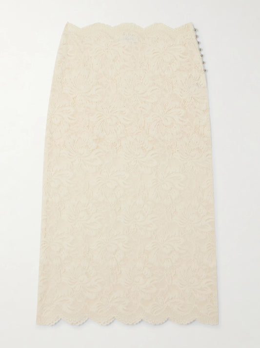 Image of a model wearing Skirts. Product name - Scalloped Lace Midi Skirt in White colour by brand - RABANNE