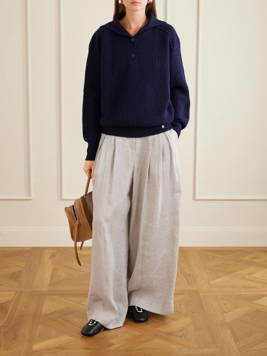 Image of a model wearing Outerwear. Product name - Ribbed-knit Cashmere And Wool-blend Turtleneck Sweater in Navy colour by brand - Stella McCartney