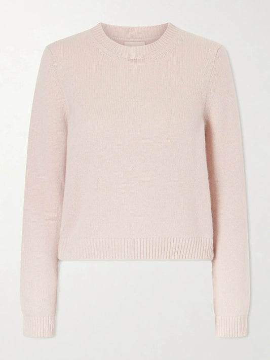 Image of a model wearing Outerwear. Product name - Leta Cashmere Sweater in Pastel pink colour by brand - KHAITE
