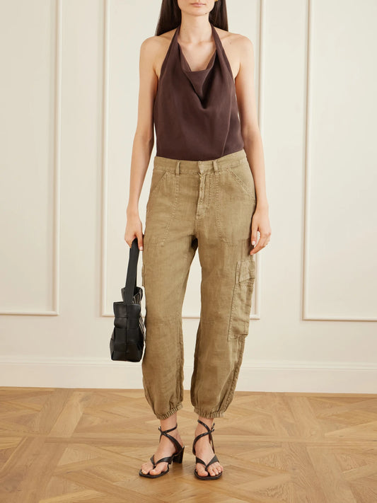Image of a model wearing Pants. Product name - Ciela Linen Tapered Pants in Beige colour by brand - Citizens of Humanity