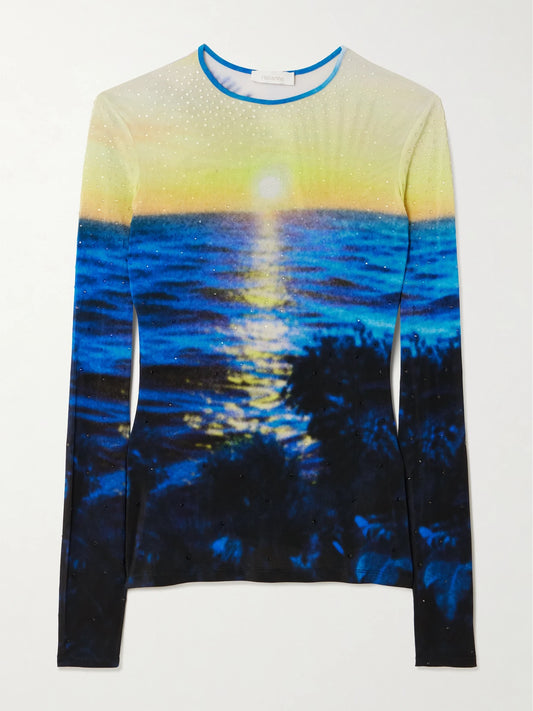Image of a model wearing Tops. Product name - Crystal-embellished Printed Jersey T-shirt in Blue colour by brand - RABANNE