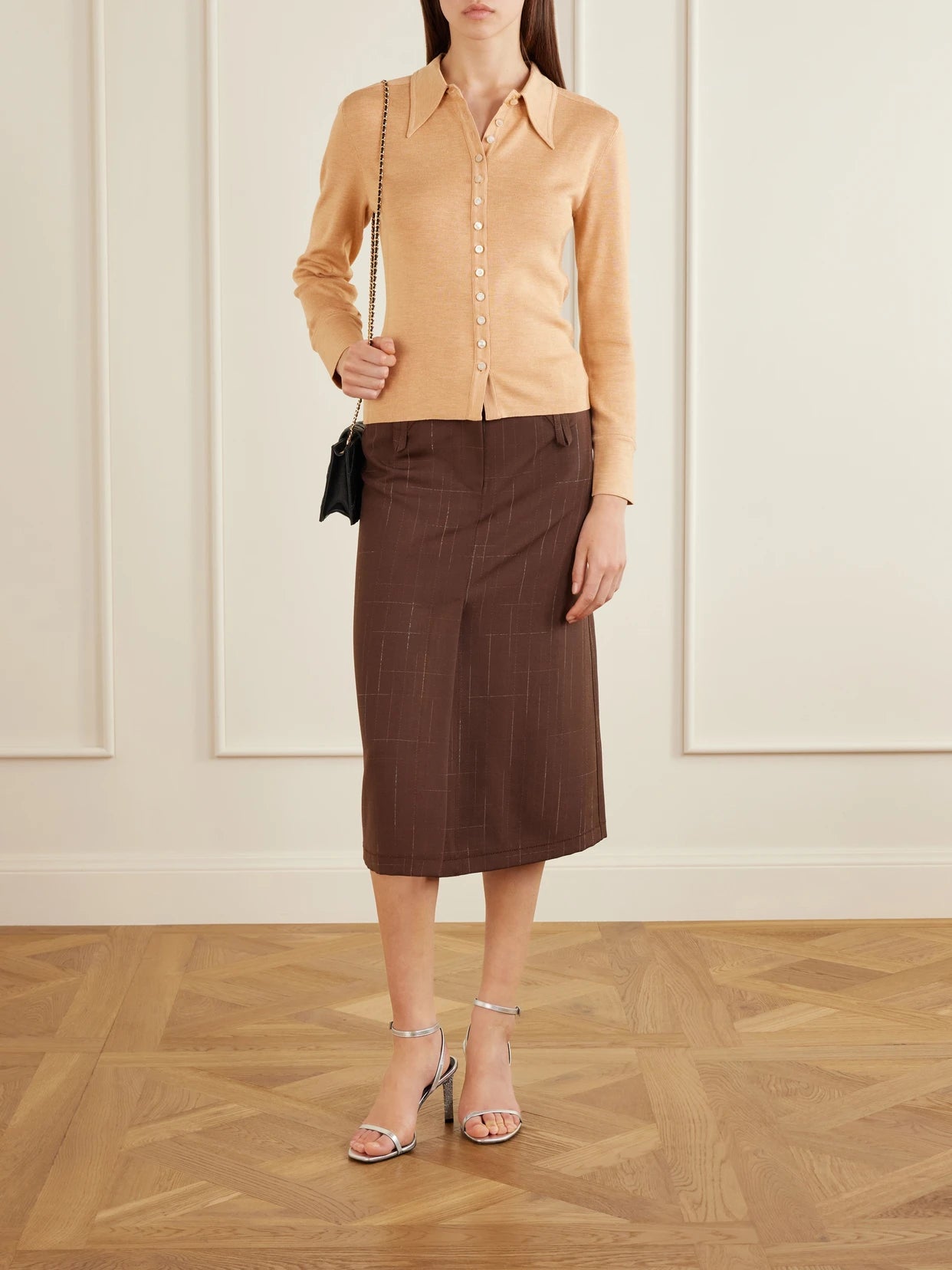 Image of a model wearing Outerwear. Product name - Silk-blend Polo Shirt in Beige colour by brand - Tory Burch