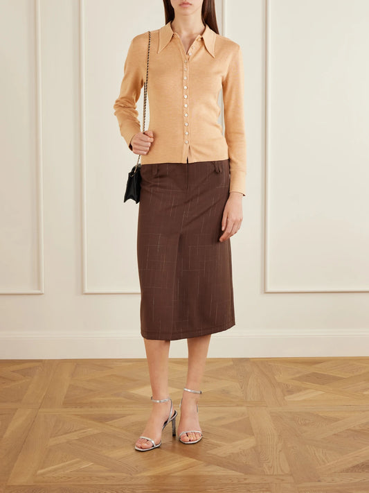 Image of a model wearing Outerwear. Product name - Silk-blend Polo Shirt in Beige colour by brand - Tory Burch
