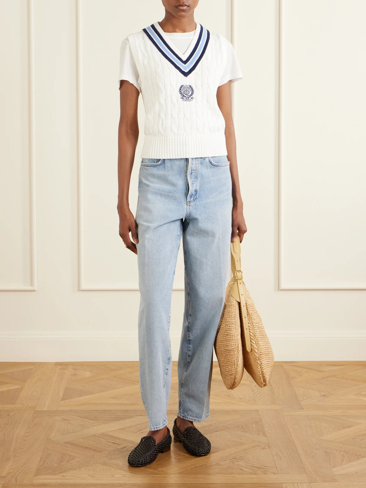 Image of a model wearing Outerwear. Product name - + Wimbledon Logo-embroidered Cable-knit Cotton Vest in Cream colour by brand - Polo Ralph Lauren