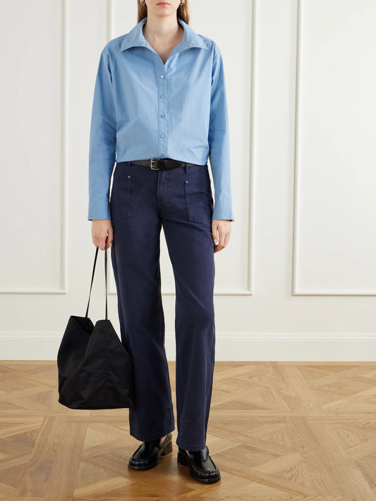 Image of a model wearing Tops. Product name - Madison Cotton-poplin Shirt in Blue colour by brand - Still Here