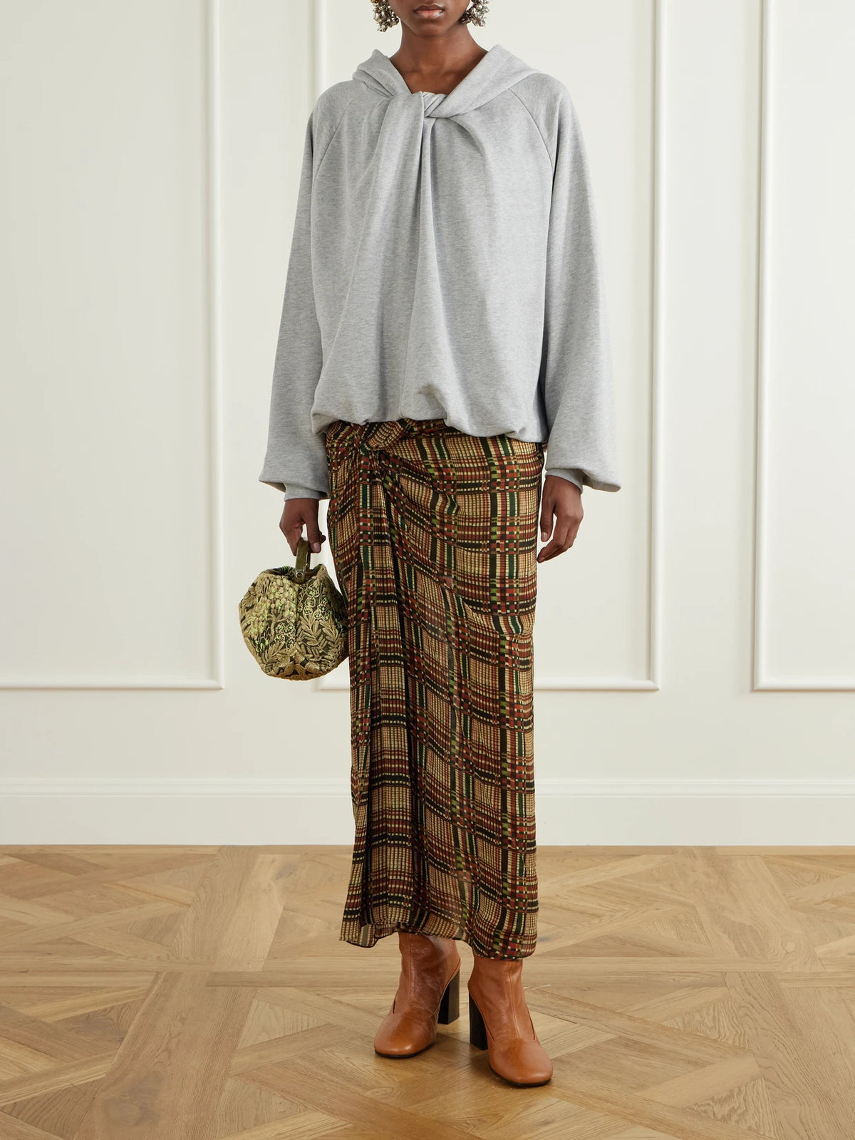 Image of a model wearing Tops. Product name - Knotted Cotton-jersey Hoodie in Gray colour by brand - Dries Van Noten