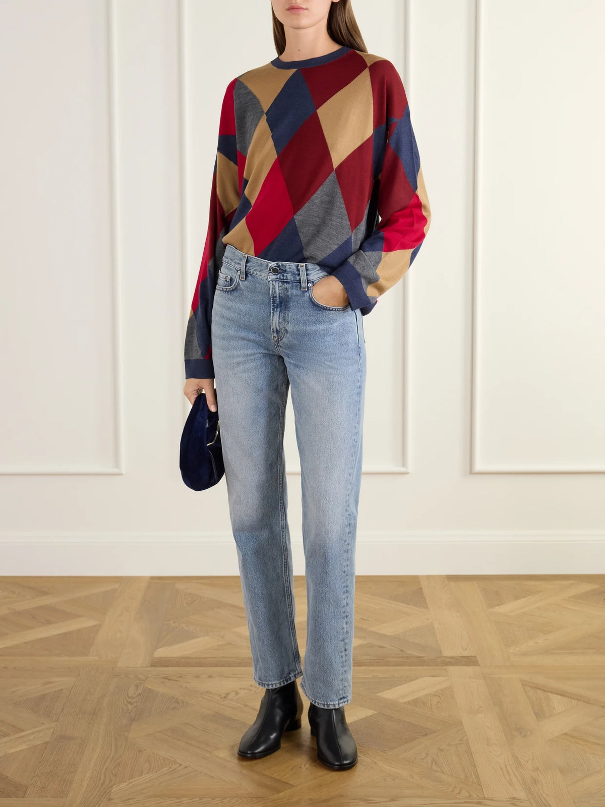 Image of a model wearing Outerwear. Product name - James Argyle Merino Wool Sweater in Multi colour by brand - LESET