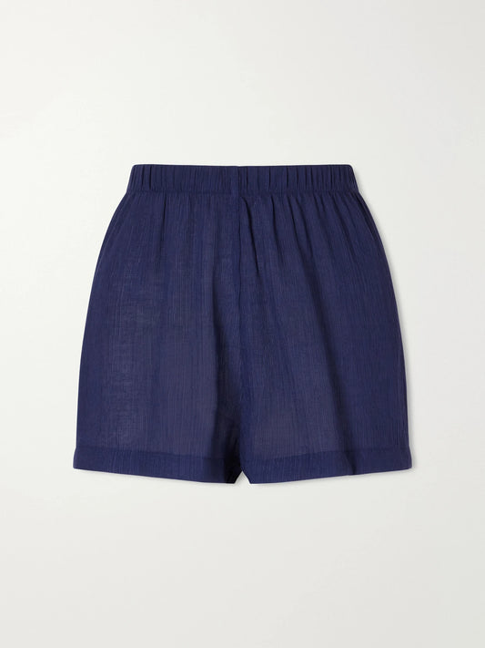 Image of a model wearing Shorts. Product name - Maldives Gauze Shorts in Blue colour by brand - Away That Day