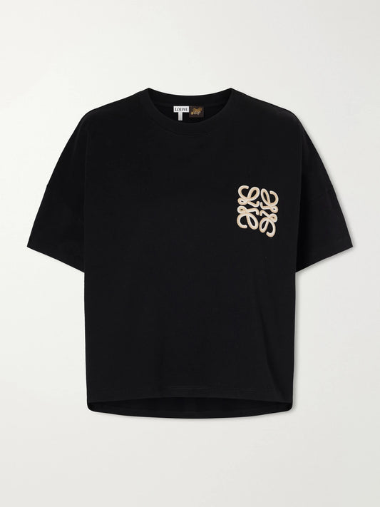 Image of a model wearing Tops. Product name - + Paula's Ibiza Anagram Embroidered Cotton-jersey T-shirt in Black colour by brand - LOEWE