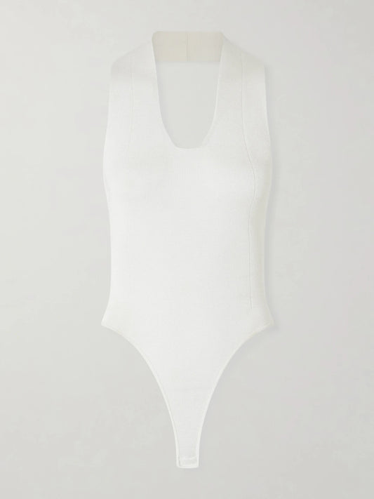 Image of a model wearing Tops. Product name - Toto Stretch-knit Halterneck Bodysuit in White colour by brand - KHAITE