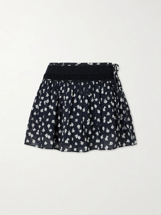 Image of a model wearing Skirts. Product name - Danielle Floral-print Lace-trimmed Cotton-voile Mini Skirt in Black colour by brand - Posse