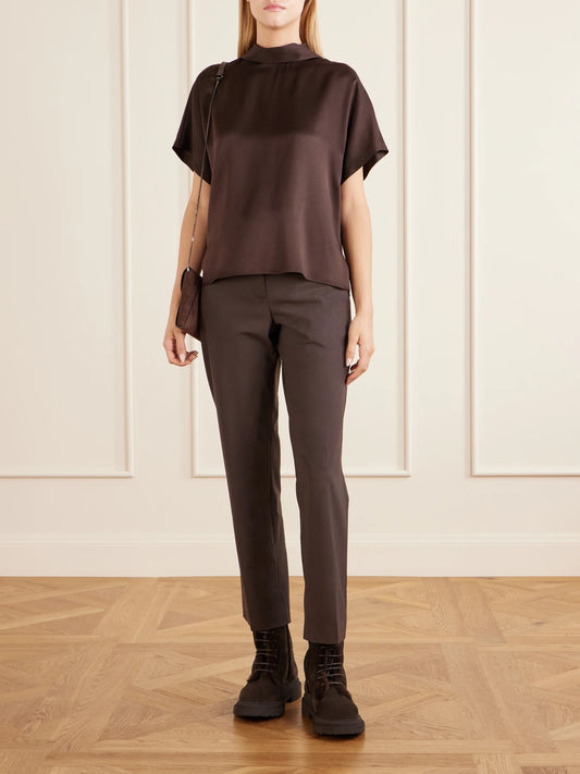 Image of a model wearing Pants. Product name - Tapered Wool-blend Pants in Dark brown colour by brand - Brunello Cucinelli