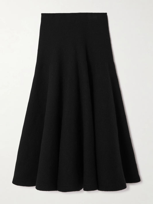 Image of a model wearing Skirts. Product name - Pleated Knitted Cashmere And Wool-blend Midi Skirt in Black colour by brand - Alaïa