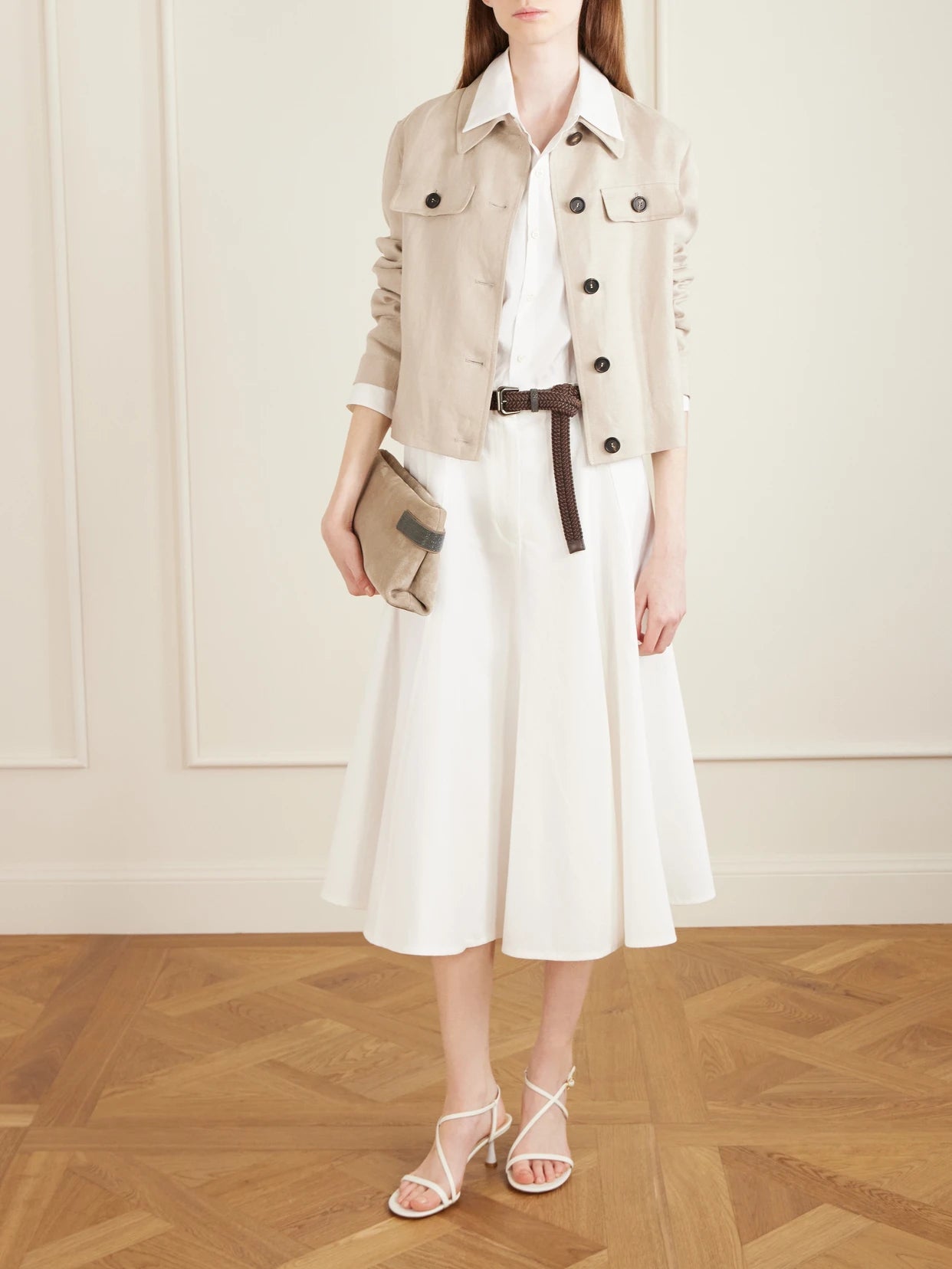 Image of a model wearing Skirts. Product name - Cotton-blend Twill Midi Skirt in White colour by brand - Brunello Cucinelli