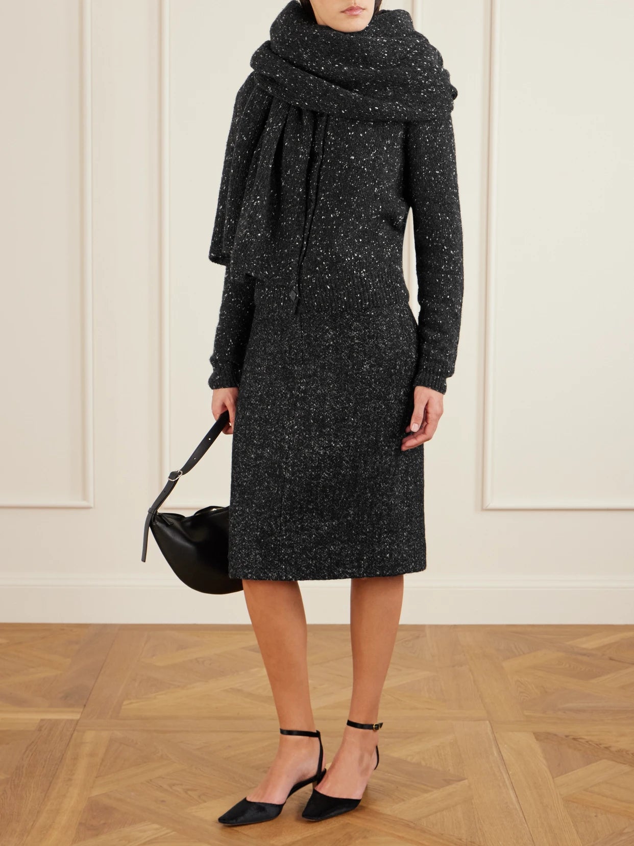 Image of a model wearing Outerwear. Product name - Maira Cashmere Sweater in Charcoal colour by brand - The Row