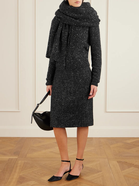 Image of a model wearing Outerwear. Product name - Maira Cashmere Sweater in Charcoal colour by brand - The Row