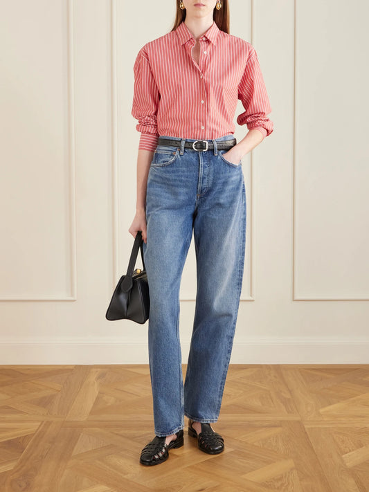 Image of a model wearing Tops. Product name - Yorke Striped Cotton Shirt in Red colour by brand - Nili Lotan