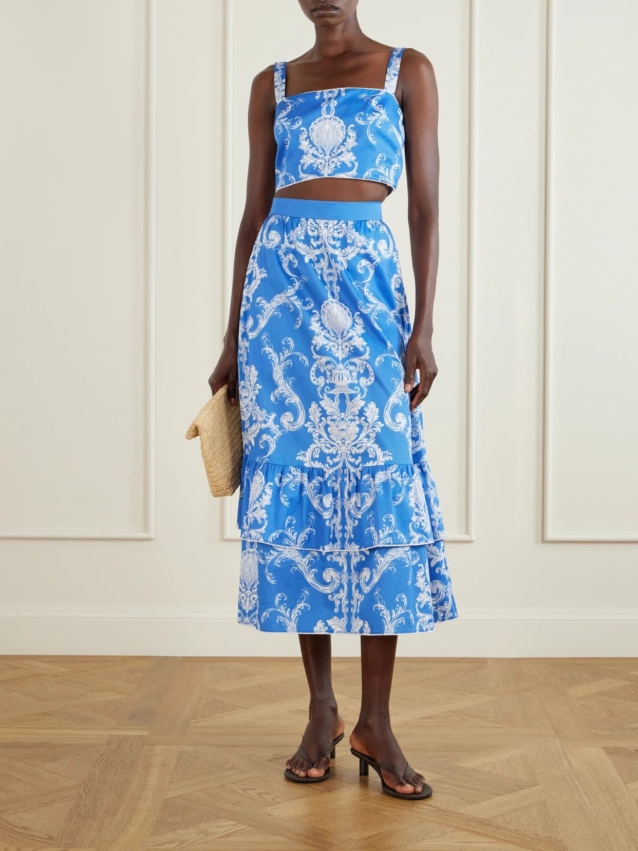 Image of a model wearing Skirts. Product name - Paulina Printed Cotton Midi Skirt in Blue colour by brand - Borgo de Nor