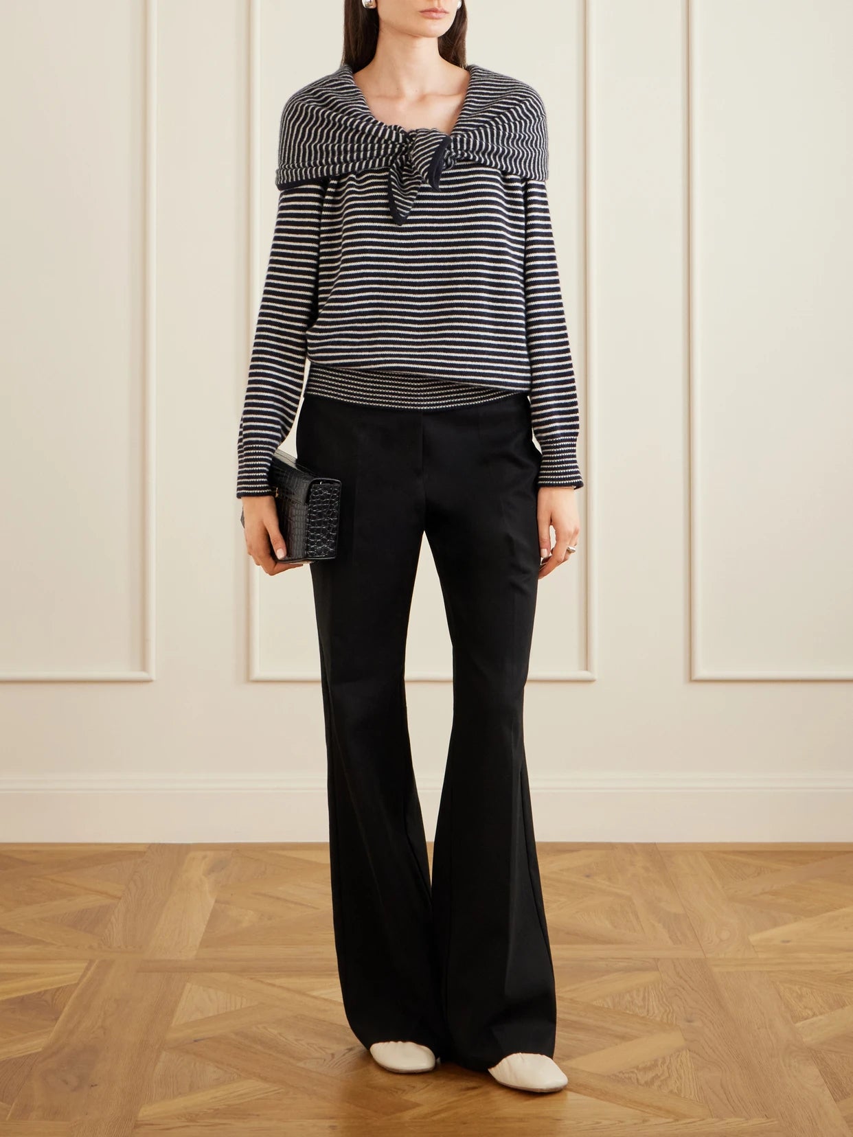 Image of a model wearing Outerwear. Product name - Maia Tiered Striped Cashmere Sweater in Multi colour by brand - TOVE
