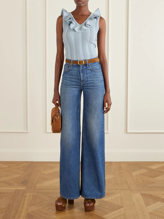 Image of a model wearing Tops. Product name - Aster Metallic Ruffled Top in Blue colour by brand - Zimmermann