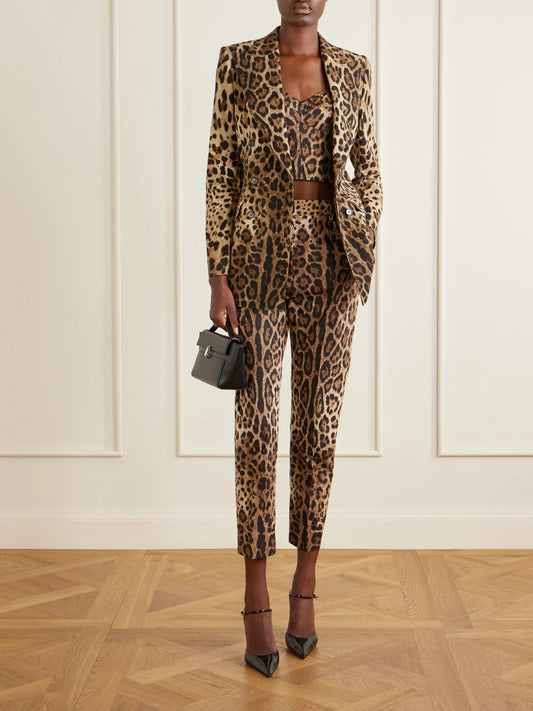 Image of a model wearing Tops. Product name - Cropped Leopard-print Stretch-canvas Bustier Top in Leopard print colour by brand - Dolce & Gabbana
