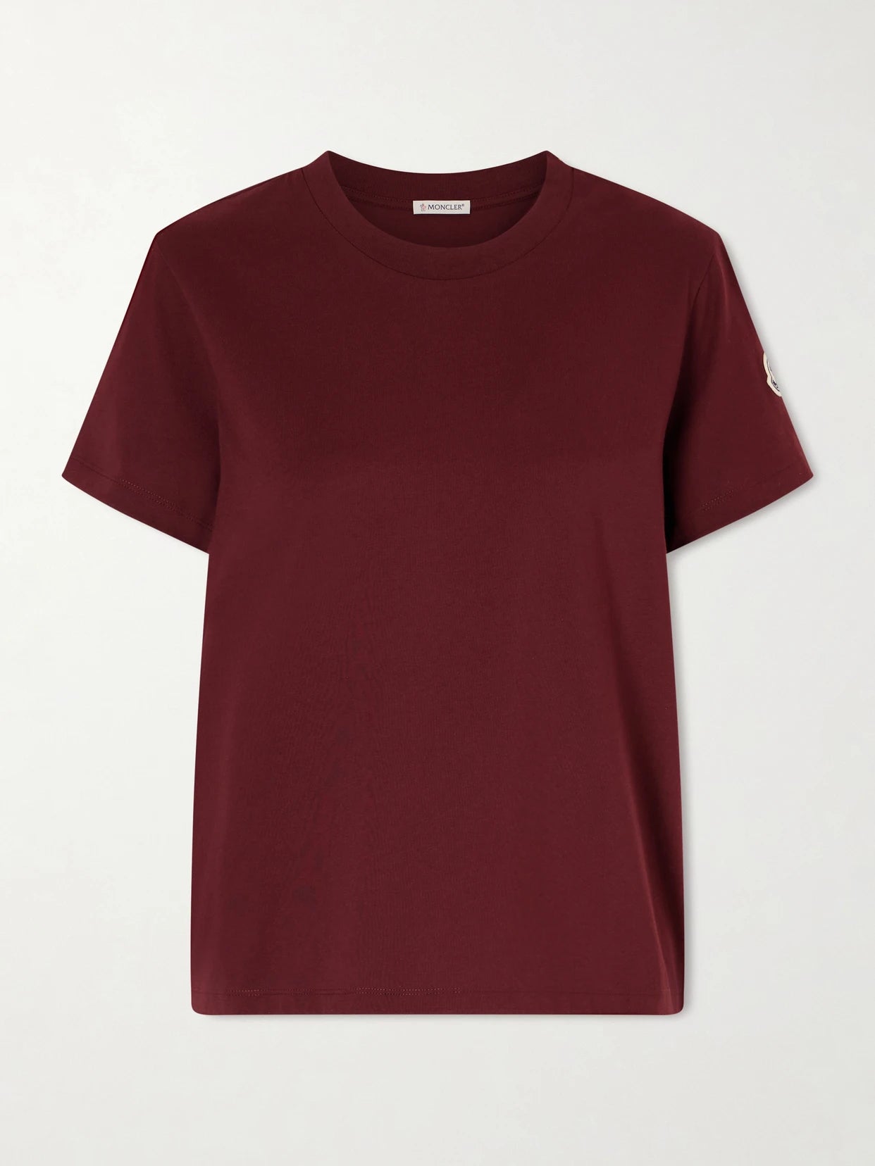 Image of a model wearing Tops. Product name - Logo-appliquéd Cotton-jersey T-shirt in Burgundy colour by brand - Moncler