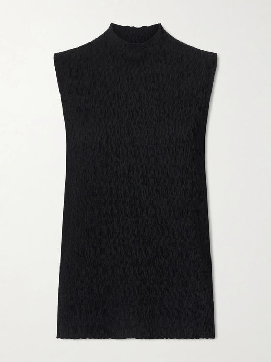 Image of a model wearing Outerwear. Product name - Oakson Silk Plissé Turleneck Sweater in Black colour by brand - The Row