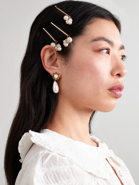 Image of Accessories. Product name - Set Of Three Gold-plated Pearl Hair Clips in Ivory colour by brand - Completedworks