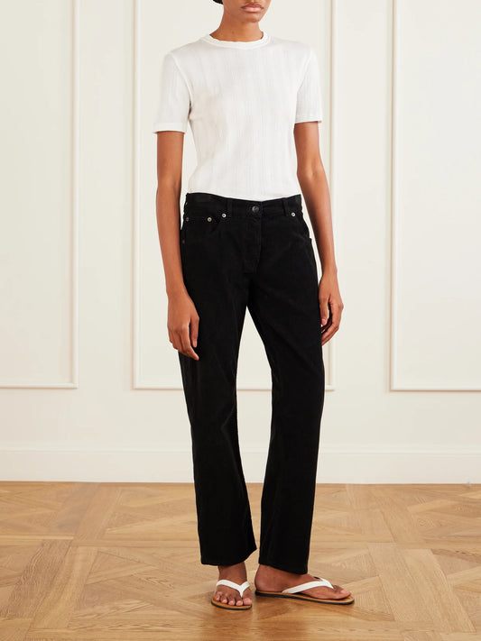 Image of a model wearing Pants. Product name - Fima Cotton-blend Corduroy Straight-leg Pants in Black colour by brand - The Row