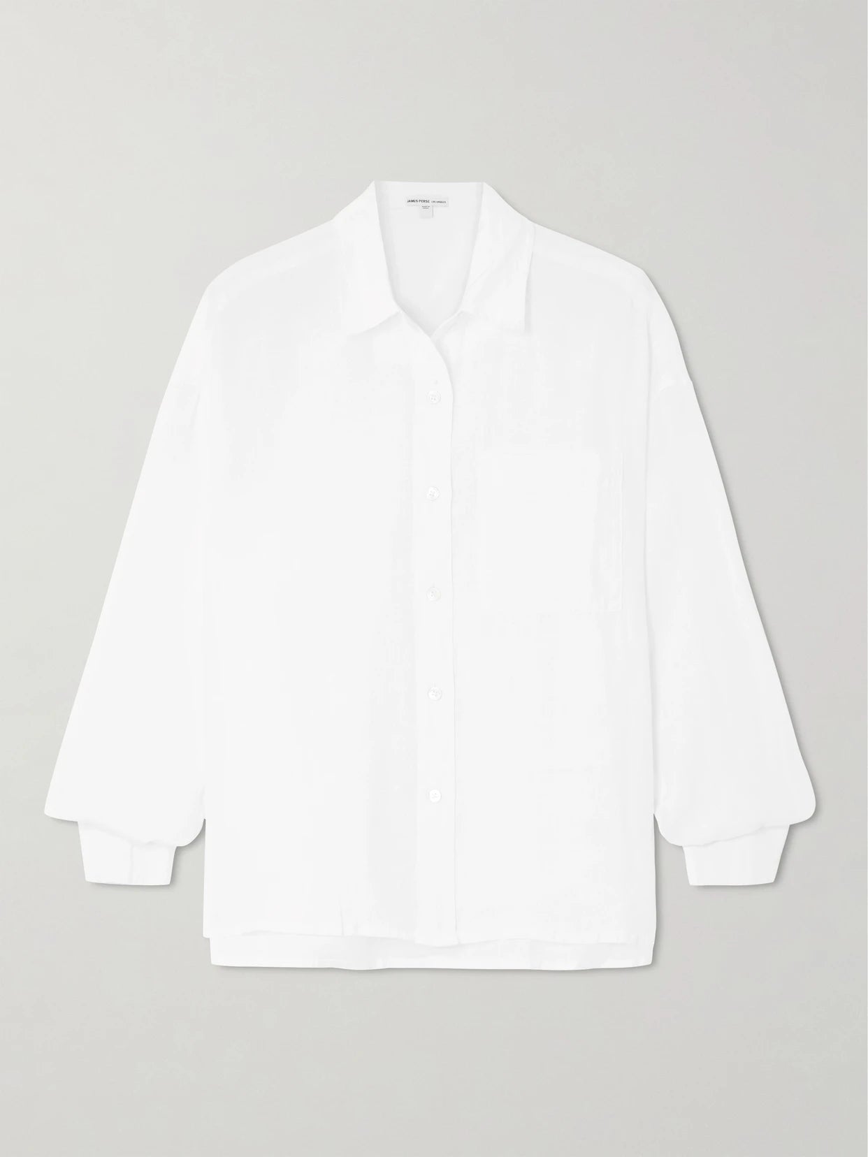 Image of a model wearing Tops. Product name - Linen Shirt in White colour by brand - James Perse