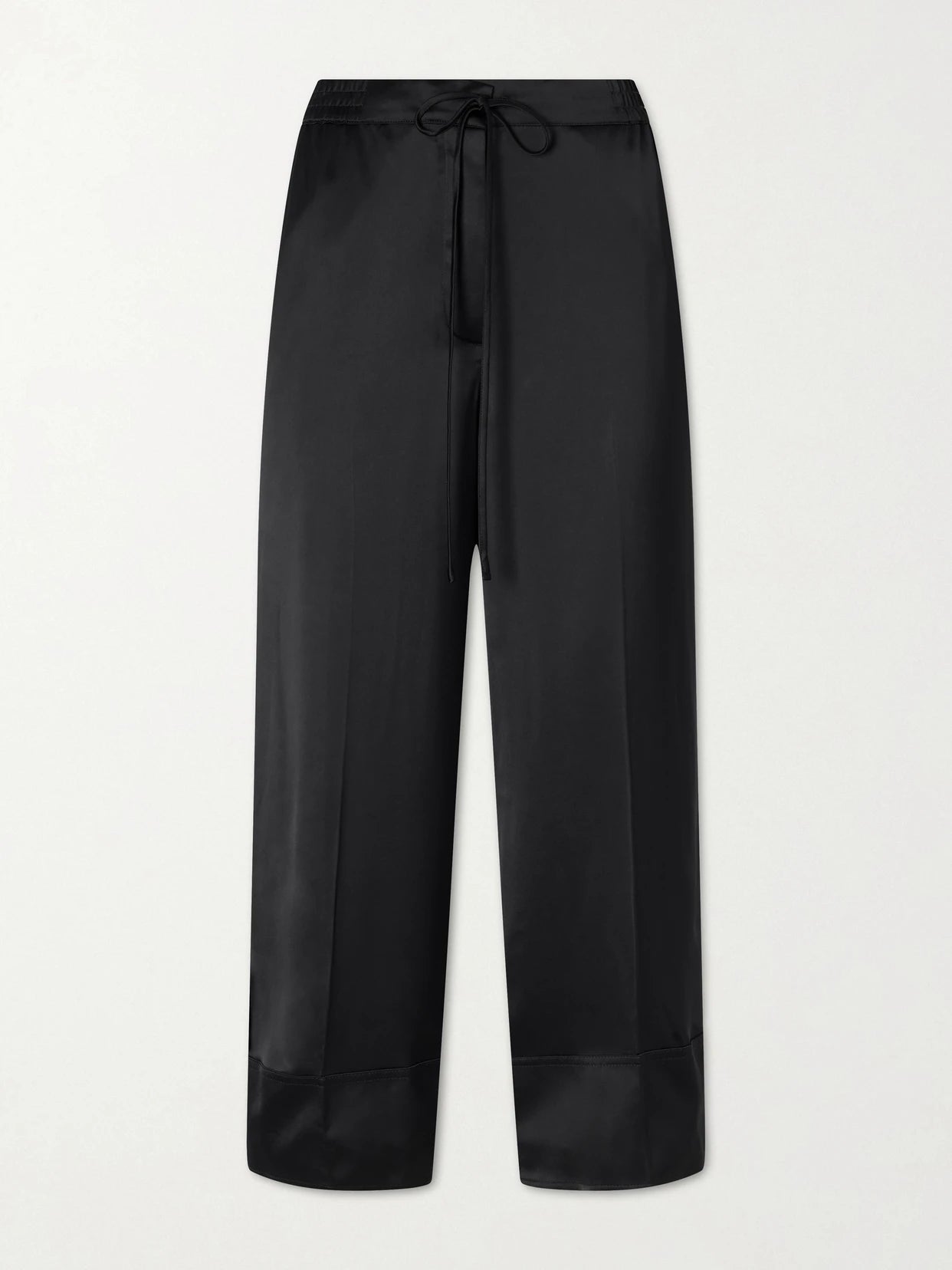 Image of a model wearing Pants. Product name - Drawstring Wide-leg Satin Pants in Black colour by brand - TOTEME
