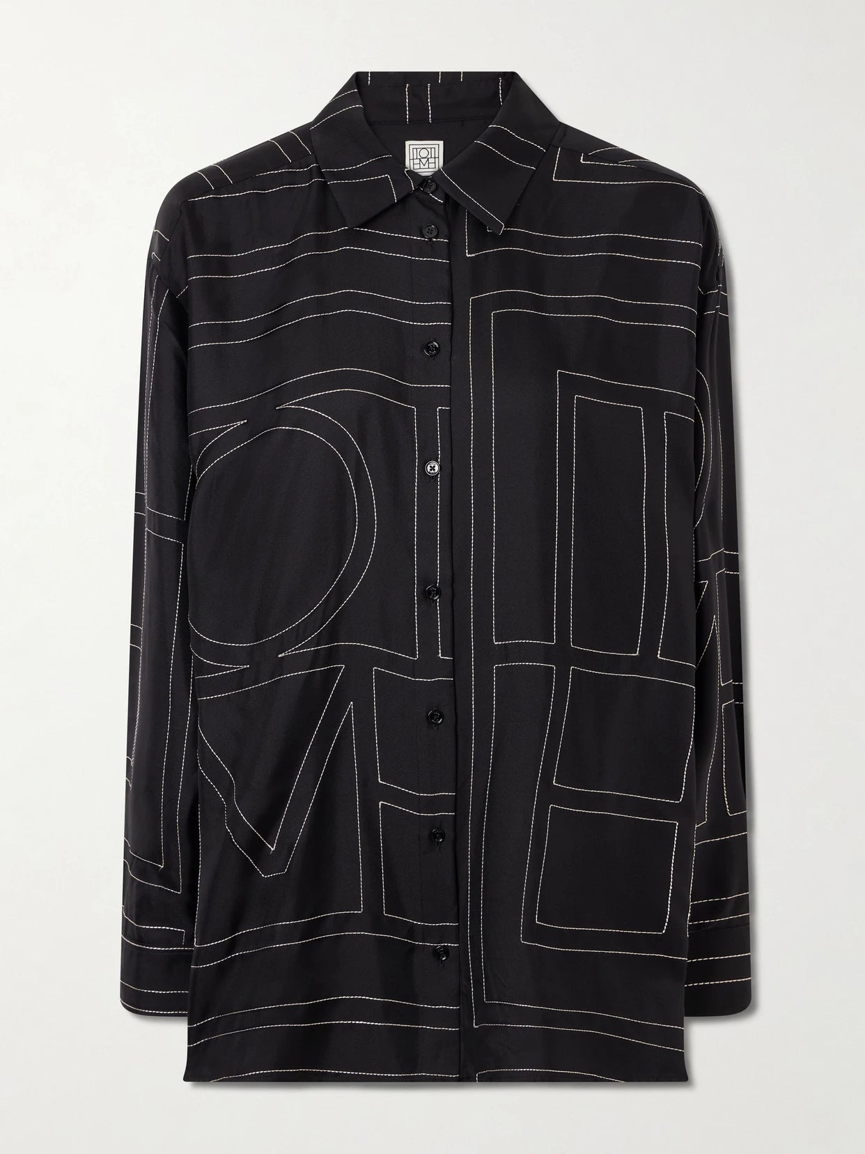 Image of a model wearing Tops. Product name - Embroidered Silk-twill Shirt in Black colour by brand - TOTEME