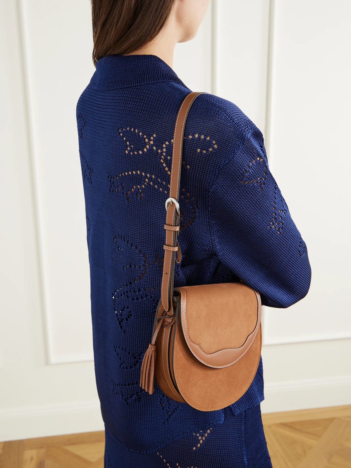 Image of Bags. Product name - The Small Saddle Tasseled Leather-trimmed Suede Shoulder Bag in Tan, Black colour by brand - Hunting Season