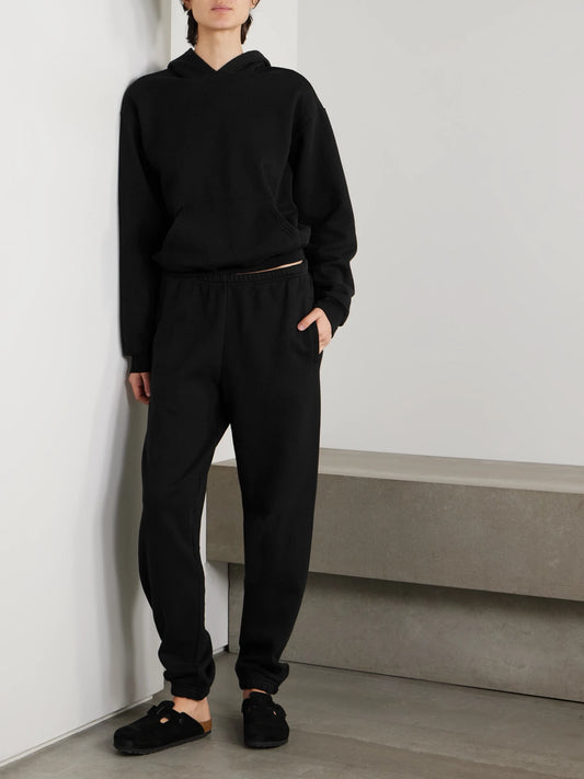 Image of Sleepwear & Loungewear. Product name - Cotton-blend Fleece Track Pants - Onyx in Black colour by brand - SKIMS