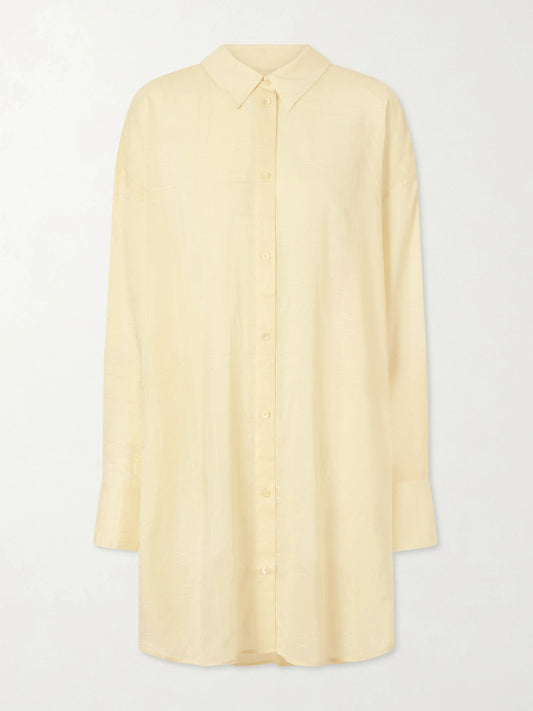 Image of a model wearing Tops. Product name - Lyocell And Cotton-blend Shirt in Pastel yellow colour by brand - TOTEME
