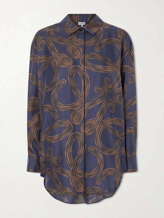 Image of a model wearing Tops. Product name - + Paula's Ibiza Anagram-printed Silk-twill Shirt in Navy colour by brand - LOEWE
