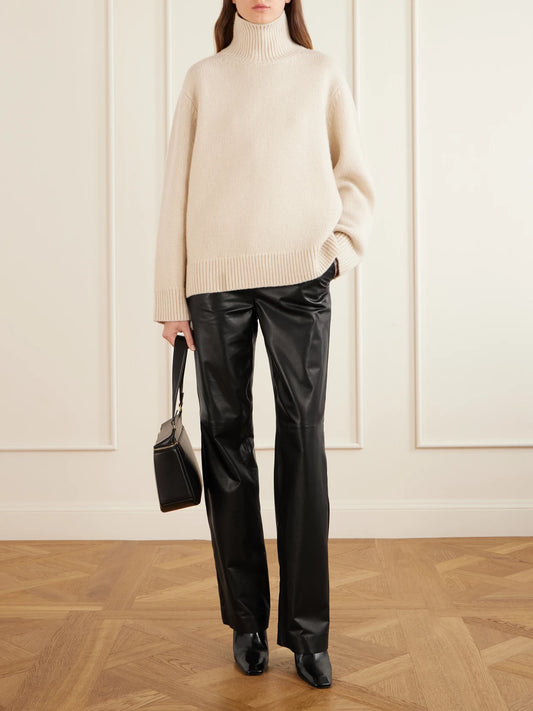Image of a model wearing Pants. Product name - Leather Straight-leg Pants in Black colour by brand - TOTEME